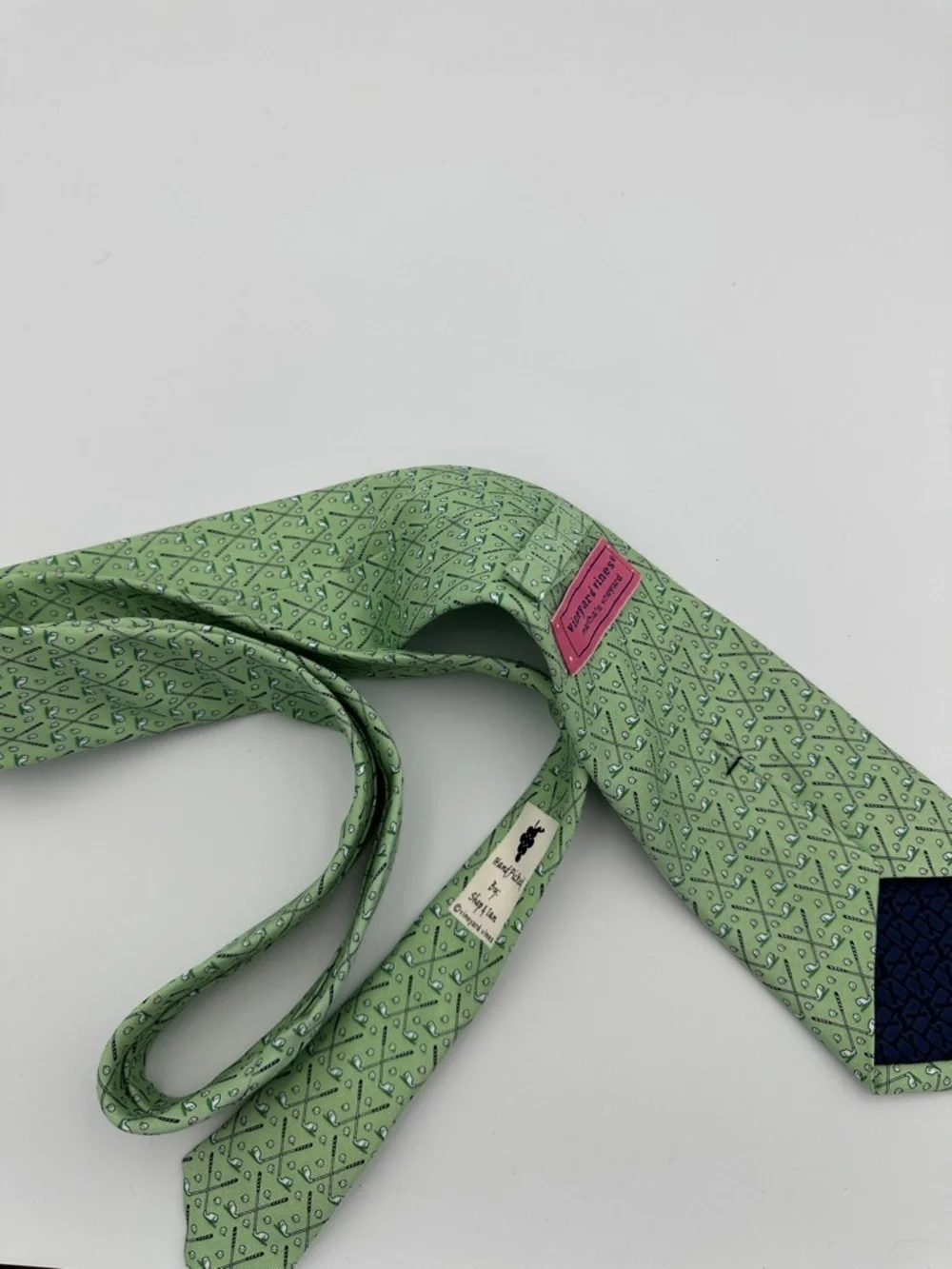 Vineyard Vines men's green silk necktie featuring a repeating golf club and ball